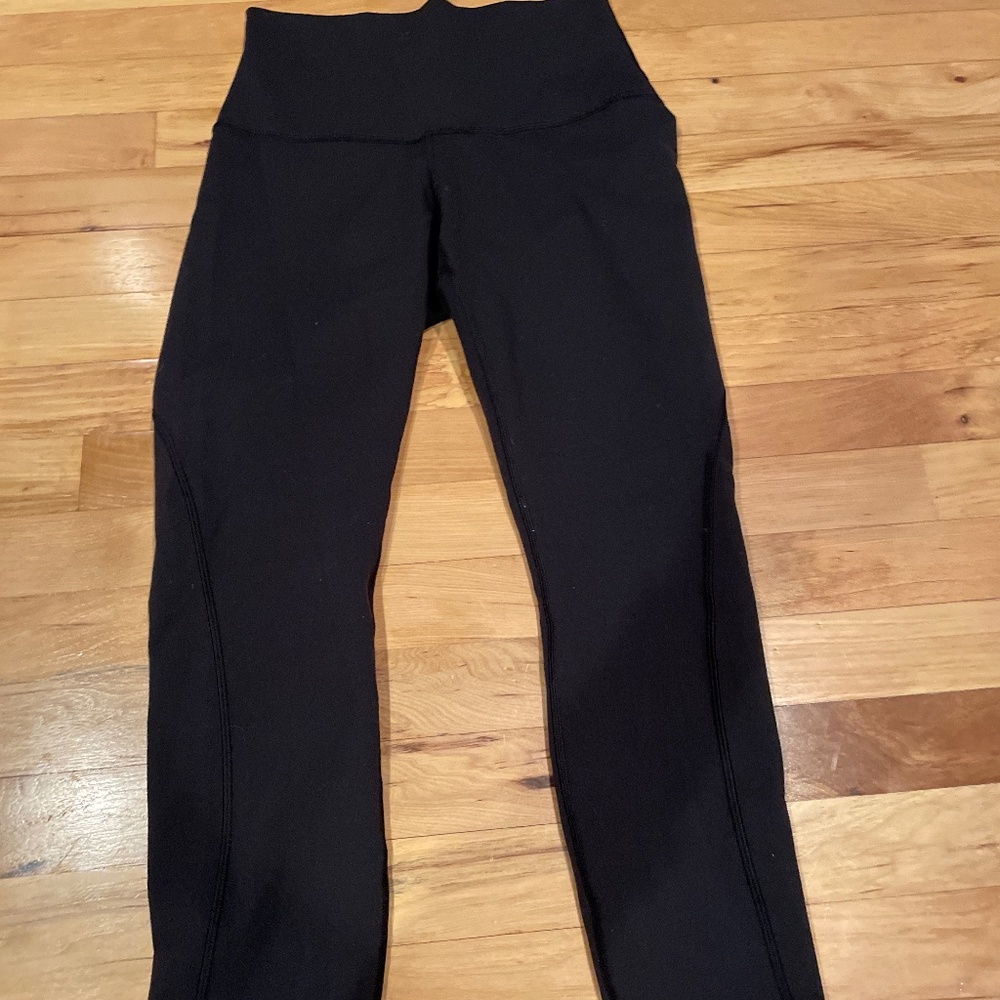 Lululemon black leggings with detailing on back Size 6